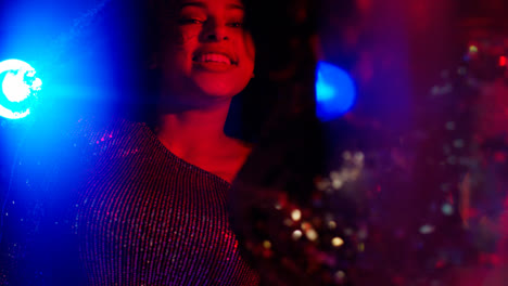 Close-Up-Of-Two-Women-In-Nightclub-Bar-Or-Disco-Dancing-With-Sparkling-Lights-9